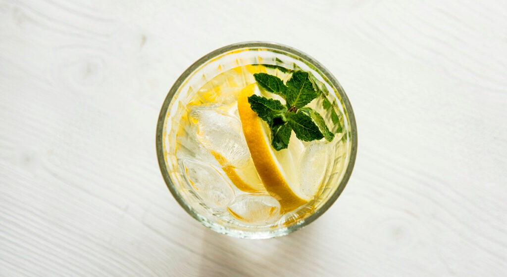 glass of water with lemon and mint