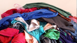 pile of cloths for declutter your closet